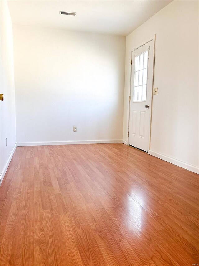entrance foyer with light wood-style flooring and baseboards