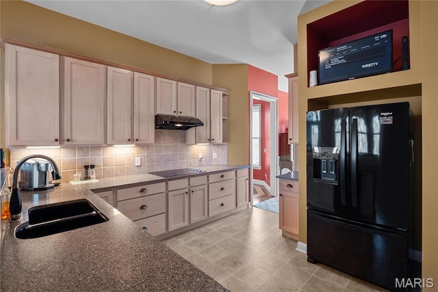 4349 Murdoch Ln, Augusta, MO 63332 - kitchen with black appliances, under cabinet range hood, a sink, decorative backsplash, and light tile patterned floors