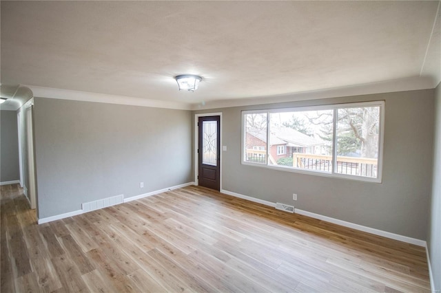 429 Oak St, East Alton, IL 62024 - foyer with baseboards, ornamental molding, and wood finished floors