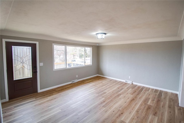 429 Oak St, East Alton, IL 62024 - foyer featuring baseboards and light wood finished floors