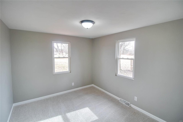 429 Oak St, East Alton, IL 62024 - carpeted empty room featuring baseboards