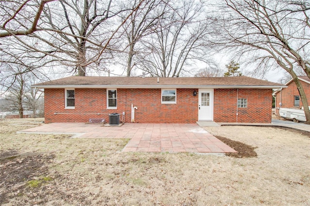 429 Oak St, East Alton, IL 62024 - rear view of property featuring brick siding, a patio, and central air condition unit