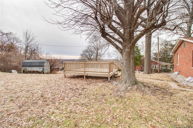 429 Oak St, East Alton, IL 62024 - view of yard with a wooden deck, a shed, and an outdoor structure