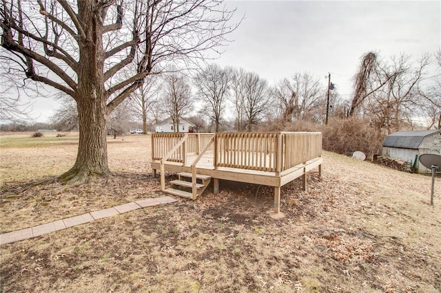 429 Oak St, East Alton, IL 62024 - view of yard featuring a wooden deck, an outbuilding, and a storage unit