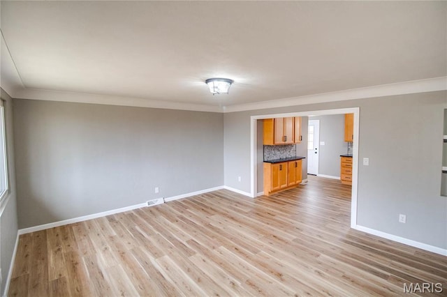 429 Oak St, East Alton, IL 62024 - unfurnished room featuring ornamental molding and light wood-style floors