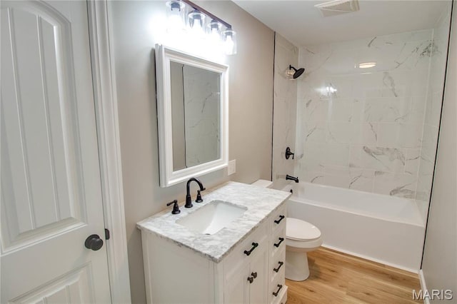 429 Oak St, East Alton, IL 62024 - bathroom with vanity, wood finished floors, and bathtub / shower combination