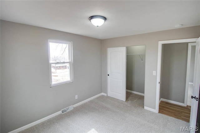 429 Oak St, East Alton, IL 62024 - unfurnished bedroom featuring carpet and a closet
