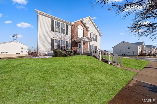 view of front of home with a front yard