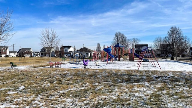 communal playground featuring a residential view