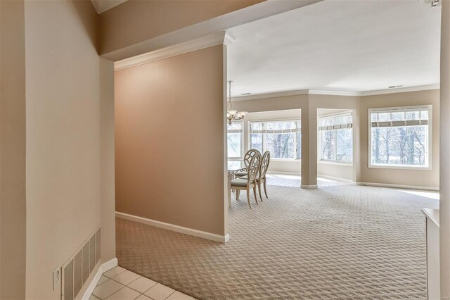 11920 Old Ballas Rd Unit 202, Saint Louis, MO 63141 - hall with carpet, ornamental molding, a chandelier, healthy amount of natural light, and baseboards