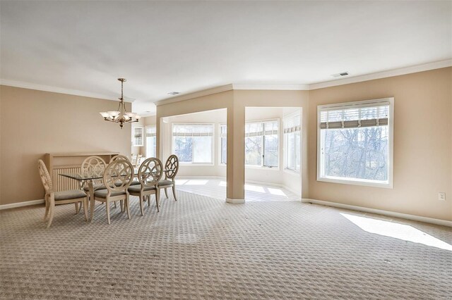 11920 Old Ballas Rd Unit 202, Saint Louis, MO 63141 - carpeted dining area with baseboards, a chandelier, plenty of natural light, and crown molding