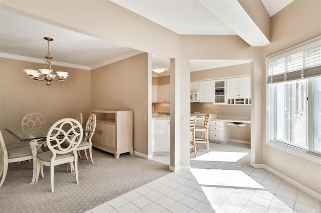 11920 Old Ballas Rd Unit 202, Saint Louis, MO 63141 - dining space featuring a chandelier, light colored carpet, light tile patterned floors, and baseboards