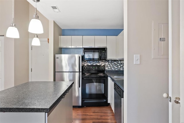 1052 S Kingshighway Blvd, Saint Louis, MO 63110 - kitchen featuring black appliances, dark countertops, electric panel, tasteful backsplash, and dark wood finished floors