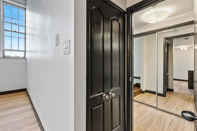 1052 S Kingshighway Blvd, Saint Louis, MO 63110 - corridor featuring light wood finished floors and baseboards