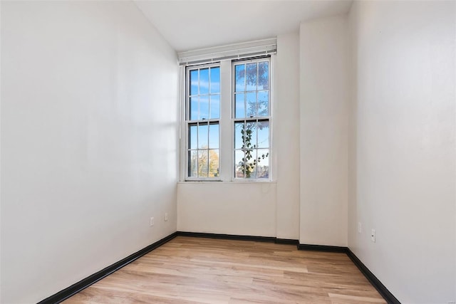 1052 S Kingshighway Blvd, Saint Louis, MO 63110 - empty room with light wood-style floors and baseboards