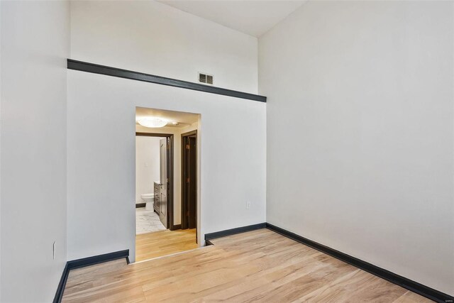 1052 S Kingshighway Blvd, Saint Louis, MO 63110 - empty room featuring light wood-style floors and baseboards