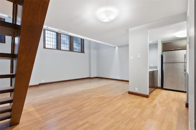 1052 S Kingshighway Blvd, Saint Louis, MO 63110 - unfurnished room featuring light wood-style floors and baseboards