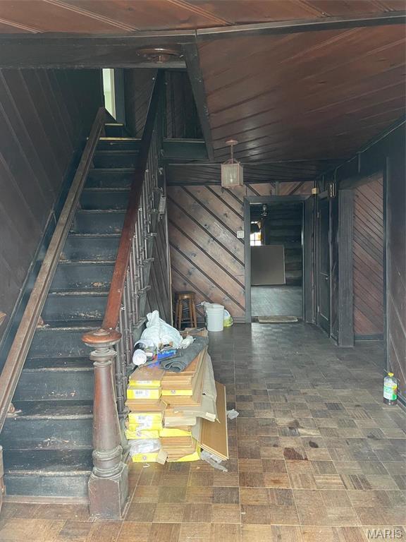 12255 Benham Rd, Saint Louis, MO 63138 - stairway with wood walls