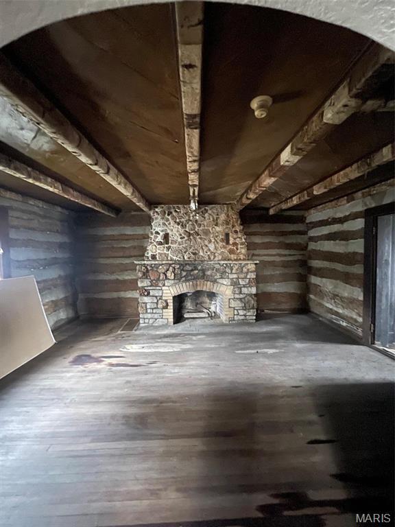 12255 Benham Rd, Saint Louis, MO 63138 - unfurnished living room with a fireplace and hardwood / wood-style flooring