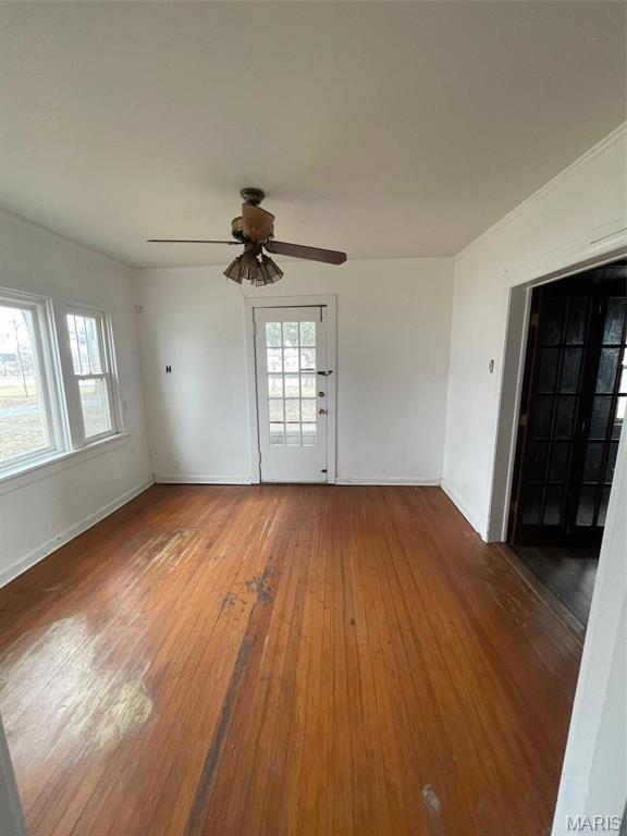 12255 Benham Rd, Saint Louis, MO 63138 - spare room featuring wood-type flooring, ceiling fan, and healthy amount of natural light