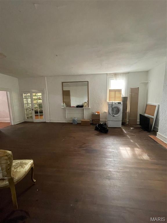 12255 Benham Rd, Saint Louis, MO 63138 - living room featuring washer / clothes dryer and wood finished floors