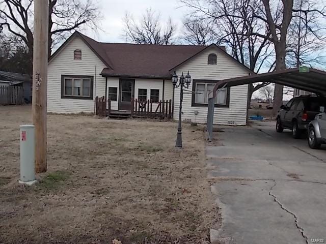 109 E Hicks, Cardwell, MO 63829 - bungalow featuring a detached carport and driveway