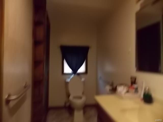 109 E Hicks, Cardwell, MO 63829 - bathroom featuring toilet and vanity