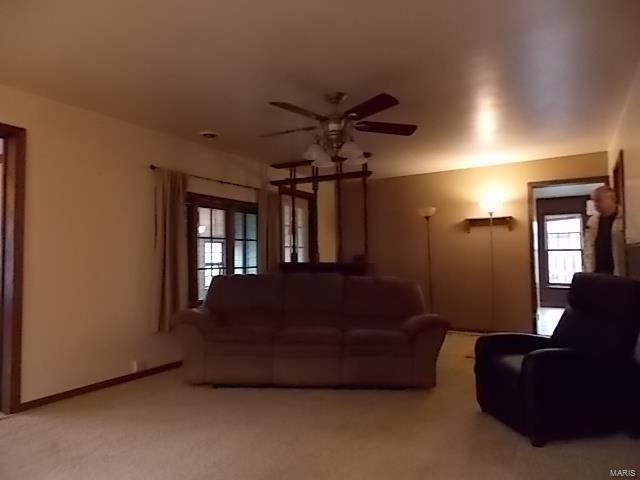 109 E Hicks, Cardwell, MO 63829 - living area featuring ceiling fan and light colored carpet