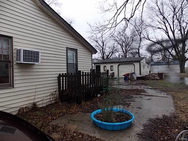 109 E Hicks, Cardwell, MO 63829 - view of side of home with an outbuilding