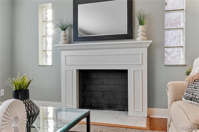 5807 Columbia Ave, Saint Louis, MO 63139 - detailed view of a fireplace with flush hearth and baseboards