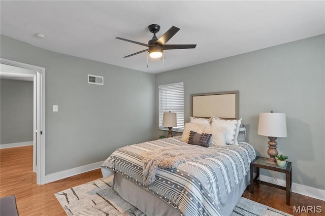 5807 Columbia Ave, Saint Louis, MO 63139 - bedroom featuring baseboards, wood finished floors, and a ceiling fan