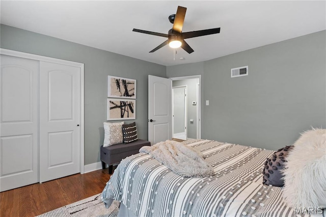 5807 Columbia Ave, Saint Louis, MO 63139 - bedroom featuring a closet, wood finished floors, ceiling fan, and baseboards