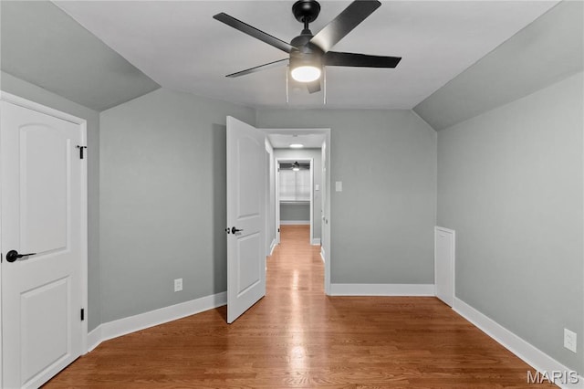 5807 Columbia Ave, Saint Louis, MO 63139 - unfurnished bedroom featuring lofted ceiling, wood finished floors, baseboards, and ceiling fan