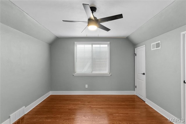 5807 Columbia Ave, Saint Louis, MO 63139 - unfurnished room with lofted ceiling, ceiling fan, wood finished floors, and baseboards