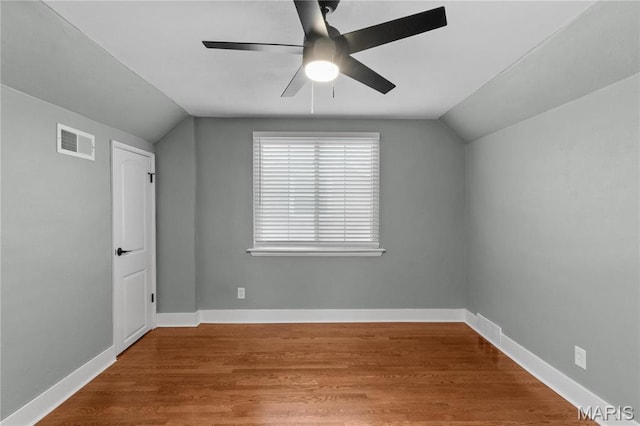 5807 Columbia Ave, Saint Louis, MO 63139 - unfurnished bedroom featuring lofted ceiling, wood finished floors, baseboards, and a ceiling fan