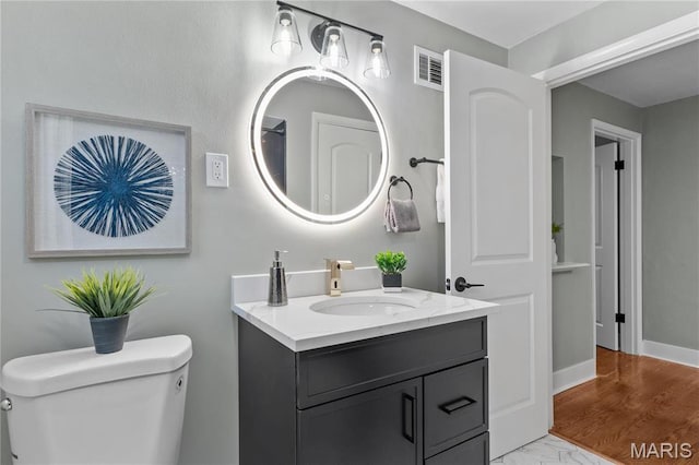 5807 Columbia Ave, Saint Louis, MO 63139 - bathroom featuring toilet and vanity
