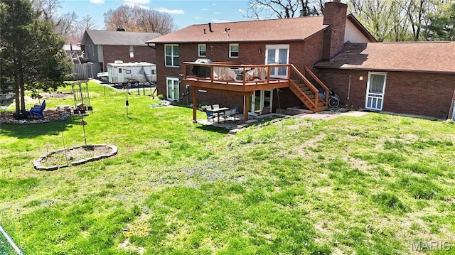 6 Ravenwood Cir, Ofallon, IL 62269 - back of property featuring a deck, a chimney, stairs, brick siding, and a lawn