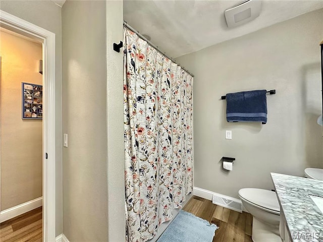6 Ravenwood Cir, Ofallon, IL 62269 - full bath featuring wood finished floors, toilet, baseboards, and vanity
