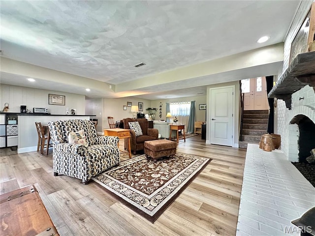 6 Ravenwood Cir, Ofallon, IL 62269 - living area with light wood-type flooring, stairs, recessed lighting, and baseboards
