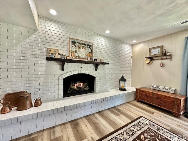 6 Ravenwood Cir, Ofallon, IL 62269 - living area with wood finished floors, a fireplace, and recessed lighting
