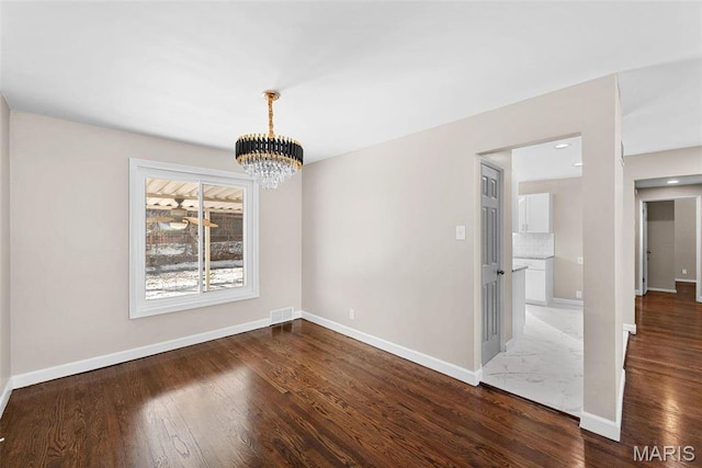 8646 Spoon Dr, Saint Louis, MO 63132 - unfurnished dining area with a chandelier, wood finished floors, and baseboards