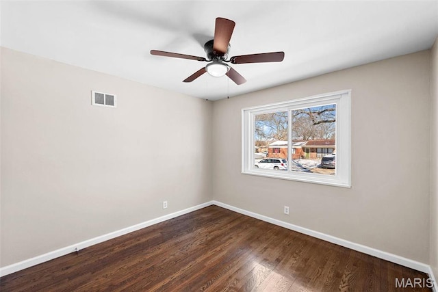 8646 Spoon Dr, Saint Louis, MO 63132 - empty room featuring baseboards, dark wood-type flooring, and ceiling fan