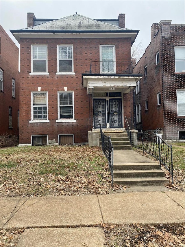 4024 Sullivan Ave, Saint Louis, MO 63107 - american foursquare style home with brick siding and a chimney