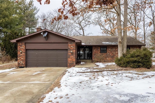 3 Echo Ln, Centralia, IL 62801 - ranch-style home featuring brick siding, a garage, concrete driveway, and a chimney