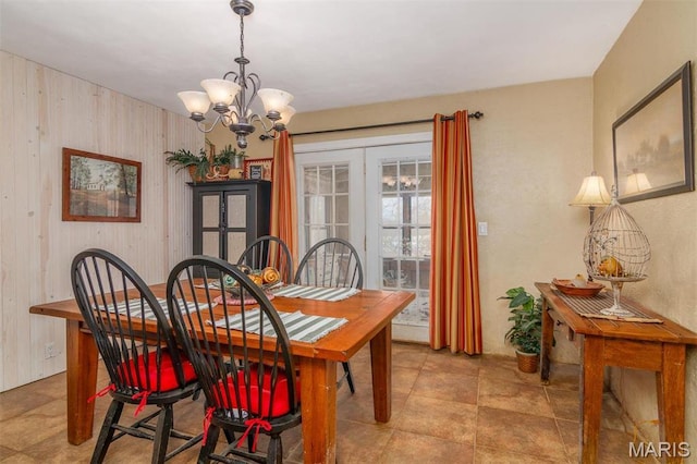 3 Echo Ln, Centralia, IL 62801 - dining area featuring a chandelier, wooden walls, and french doors