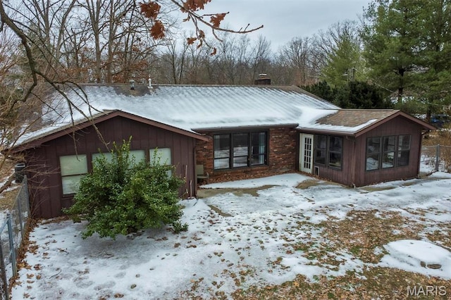 3 Echo Ln, Centralia, IL 62801 - snow covered property with a chimney, a sunroom, and fence