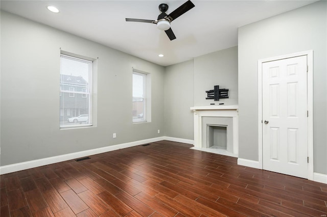 7915 S Broadway, Saint Louis, MO 63111 - unfurnished living room featuring ceiling fan, wood finished floors, a fireplace with flush hearth, baseboards, and recessed lighting