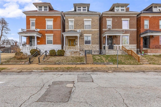 5029 Wells Ave, Saint Louis, MO 63113 - view of front facade featuring stone siding