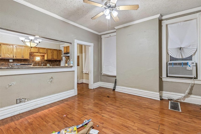 5029 Wells Ave, Saint Louis, MO 63113 - unfurnished living room with cooling unit, light wood-style flooring, a ceiling fan, ornamental molding, and baseboards