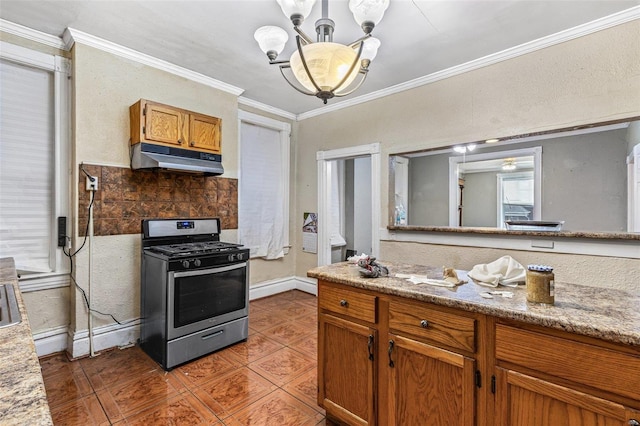 5029 Wells Ave, Saint Louis, MO 63113 - kitchen featuring stainless steel gas range, under cabinet range hood, a chandelier, brown cabinetry, and tile patterned flooring